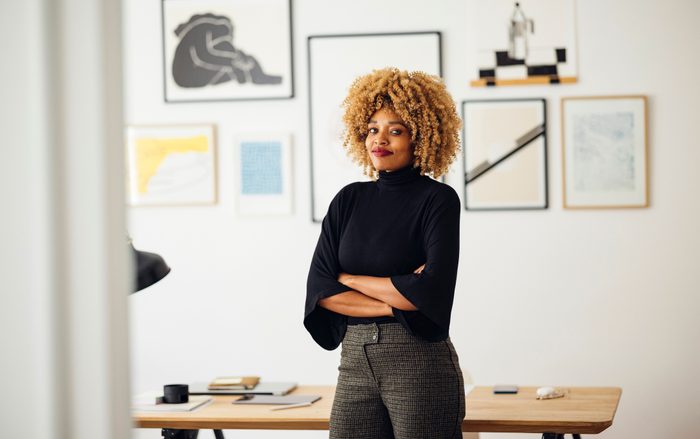 Confident Beautiful Woman Standing in her Home Office