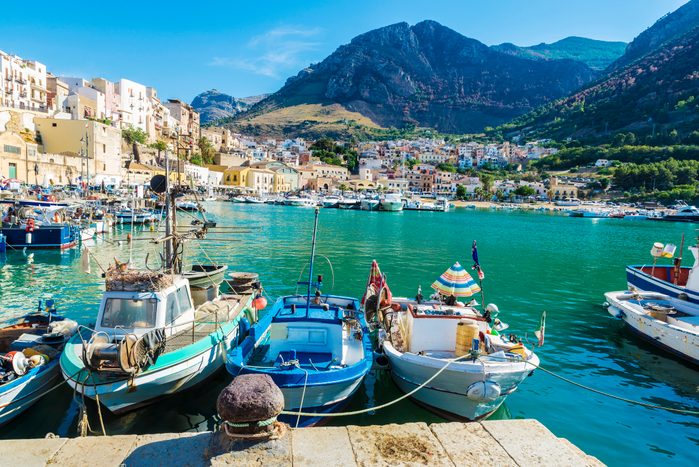 Fishing port with old wooden fishing boats in Sicily, Italy