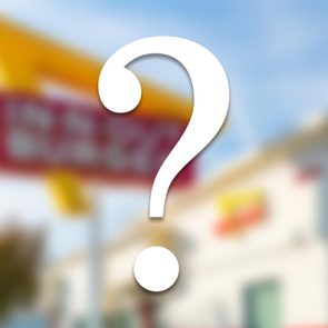 blurred fast food restaurant with a white question mark overlay