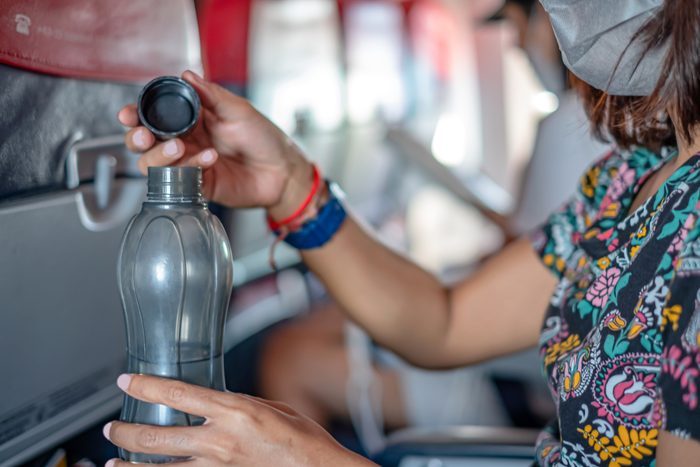 Indonesian Woman Stay Hydrated on Long Haul Flights