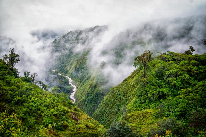 Tranquil scene of river valley in clouds