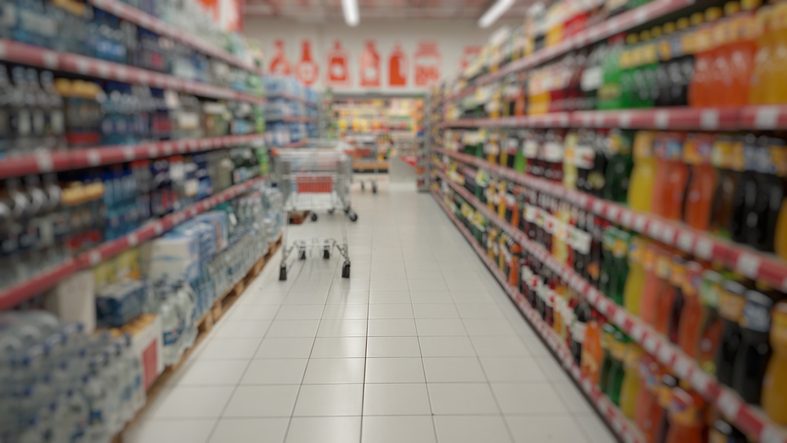 Blurry unfocused background of goods in the supermarket