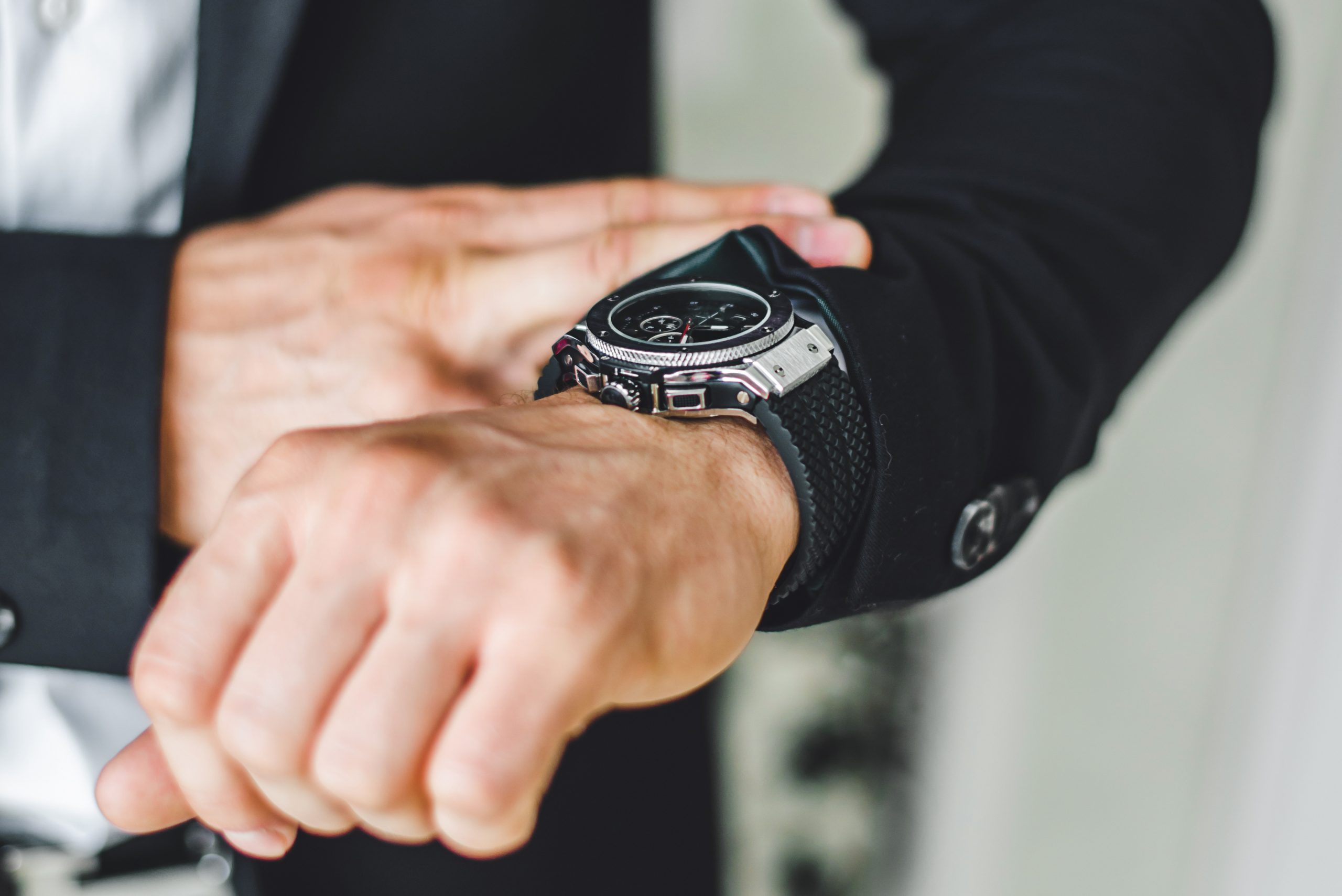 businessman looking at his watch.