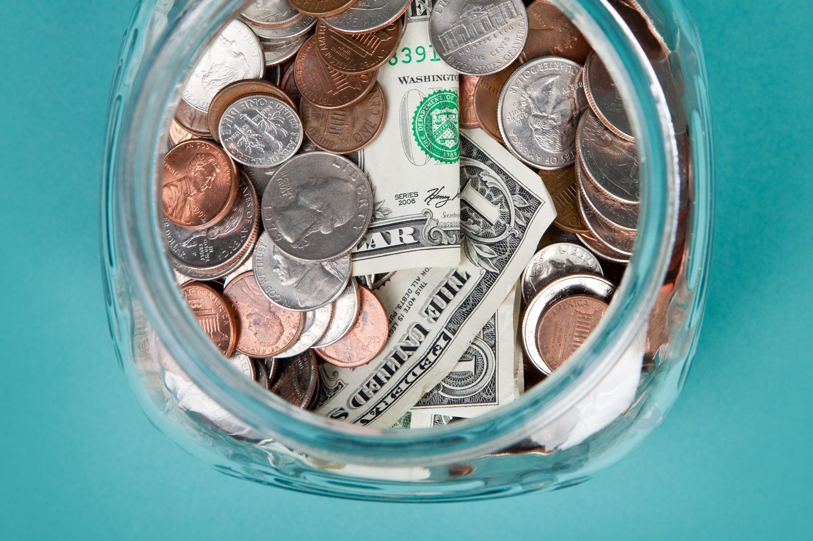 A view from above a jar full of money.
