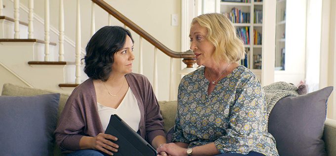 two women talking couch