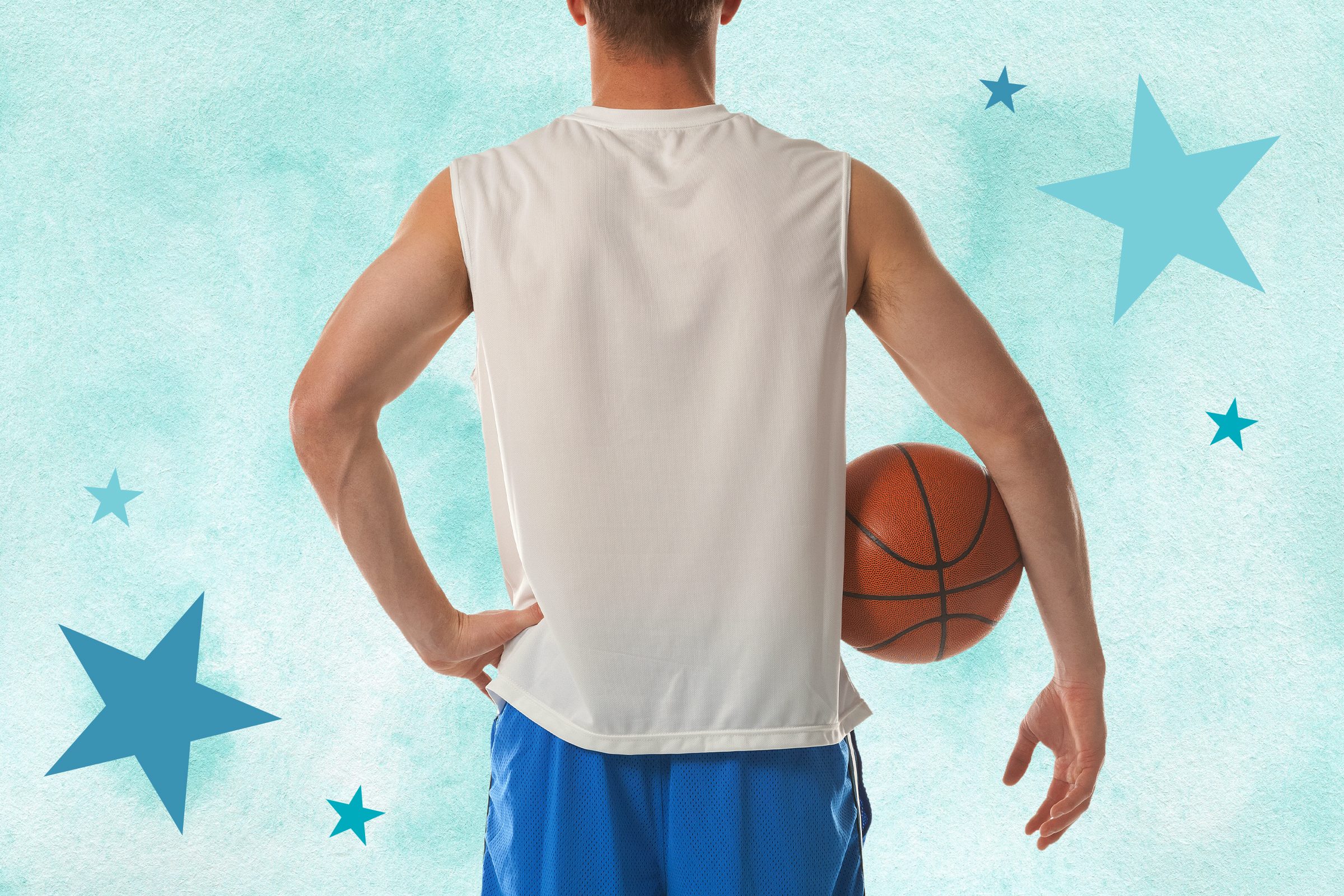 Man holding a basketball with back turned and hand on hip