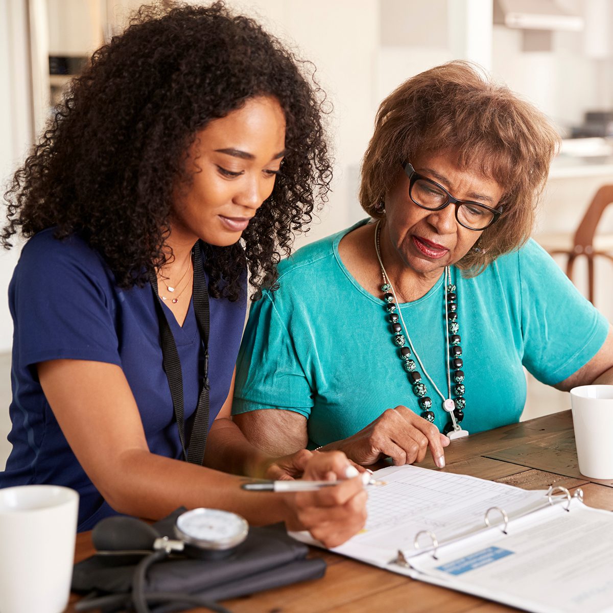 doctor reviewing paperwork with a patient