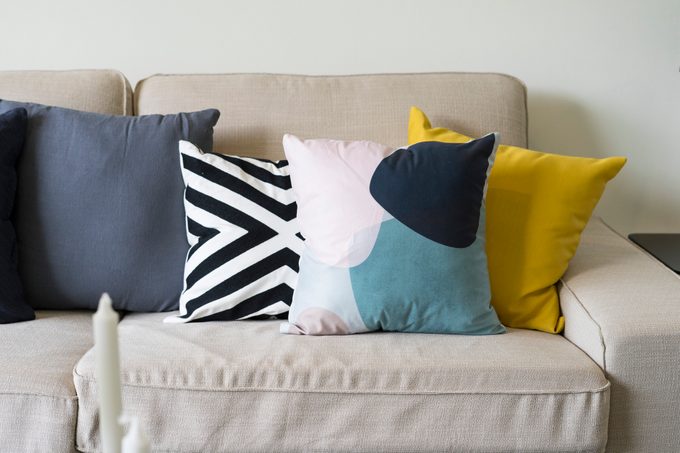 modern cushion on grey sofa in living room