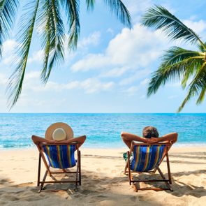 Couple relax on the beach enjoy beautiful sea on the tropical island