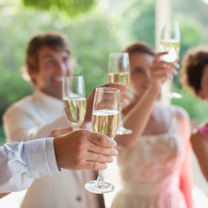 Guests toasting with champagne at wedding reception
