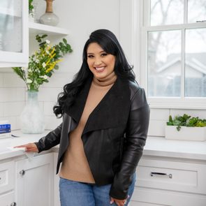 Vanesa Amaro cleaning in the kitchen