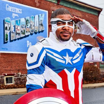 Timothy White Jr. in a Captain America costume standing in front of a Penbrook, PA mural