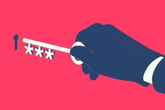 A Gloved Hand inserts key with asterisks into keyhole, cyber crime concept