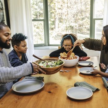 High angle view of family having meal together