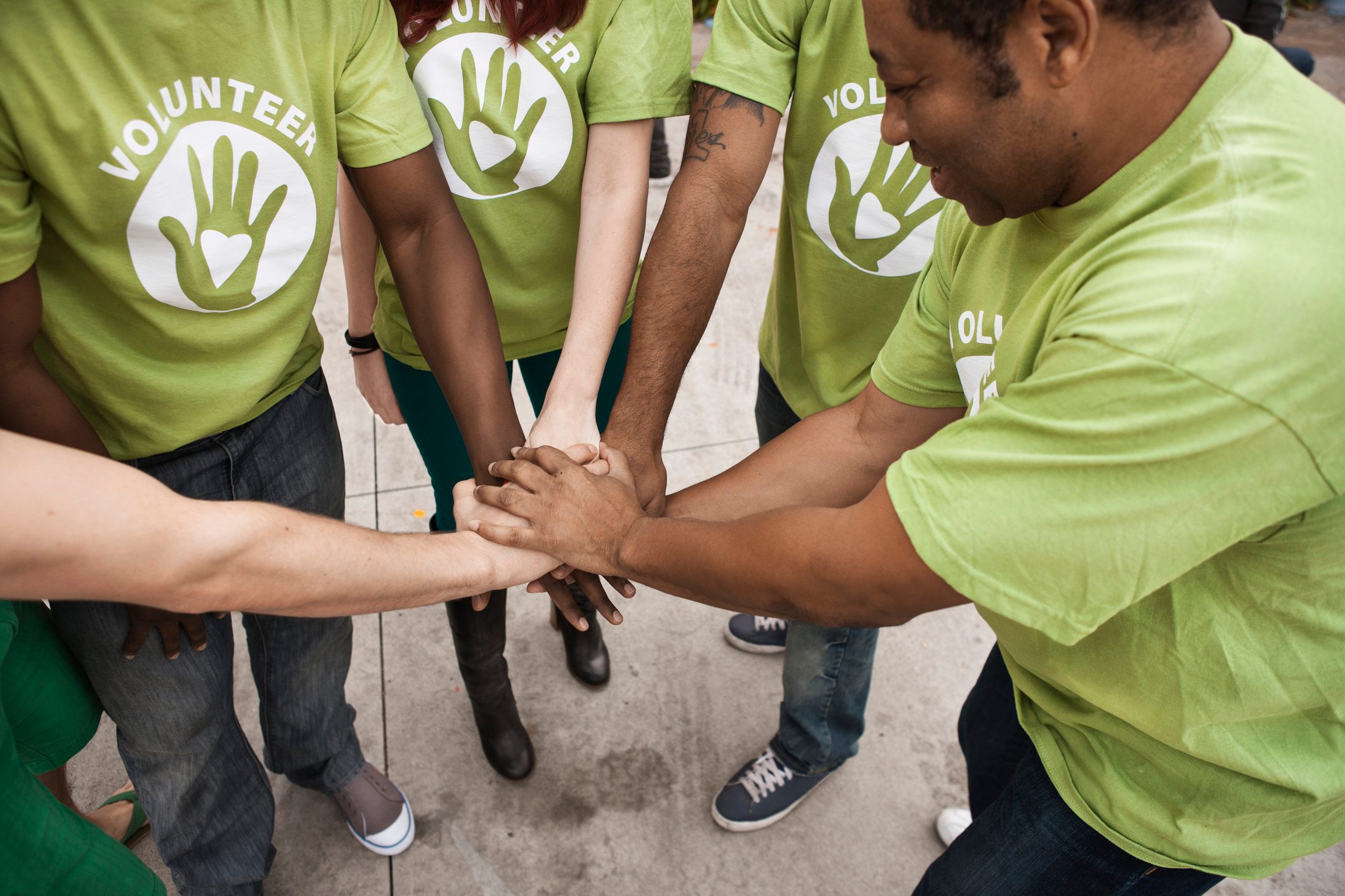 Volunteers holding hands in circle