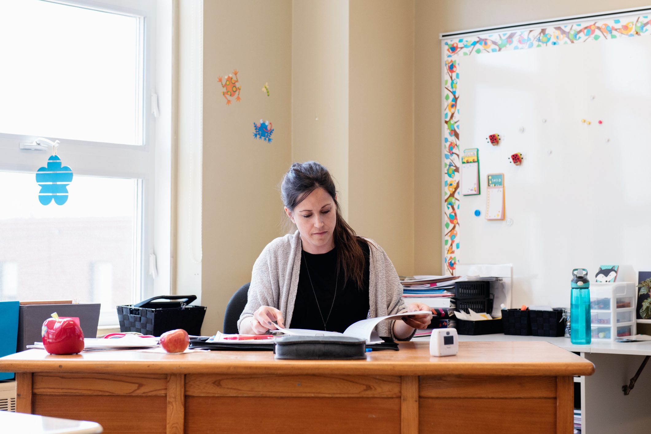 Teacher in a Classroom without students at school's out.