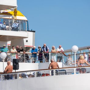 view of a cruise deck with many guests outside