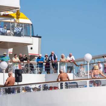 view of a cruise deck with many guests outside