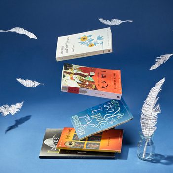 a selection of the Best Poetry Books Of All Time floating in a stack with feathers made out of paper also floating; dark blue background