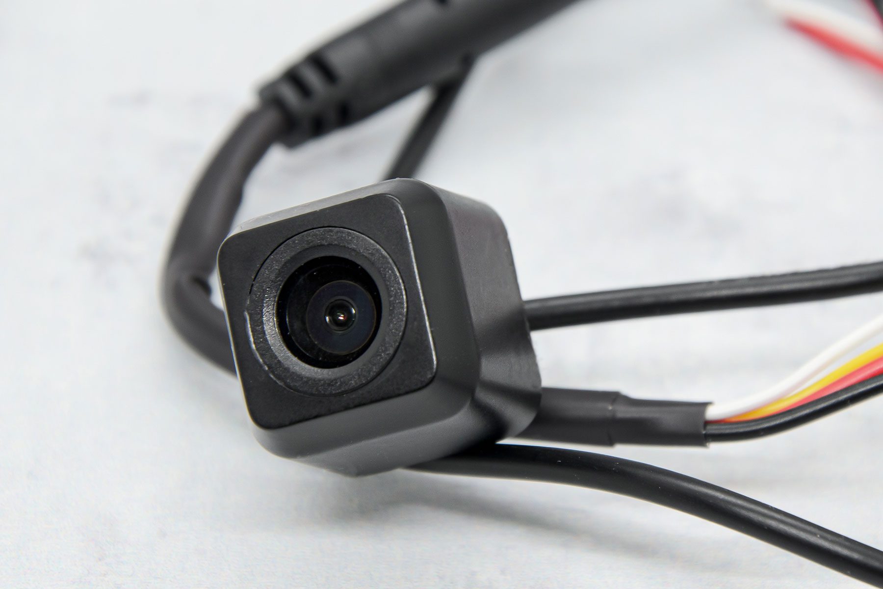 Close-up car rear view waterproof camera on gray background