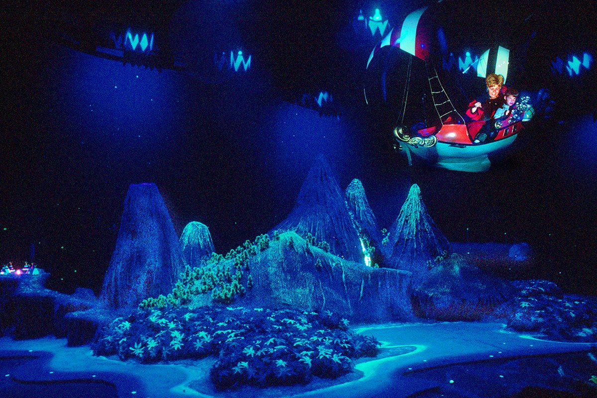 an unidentified woman and child as they ride the suspended Peter Pan's Flight attraction at Disneyland, Anaheim, California, September 1962