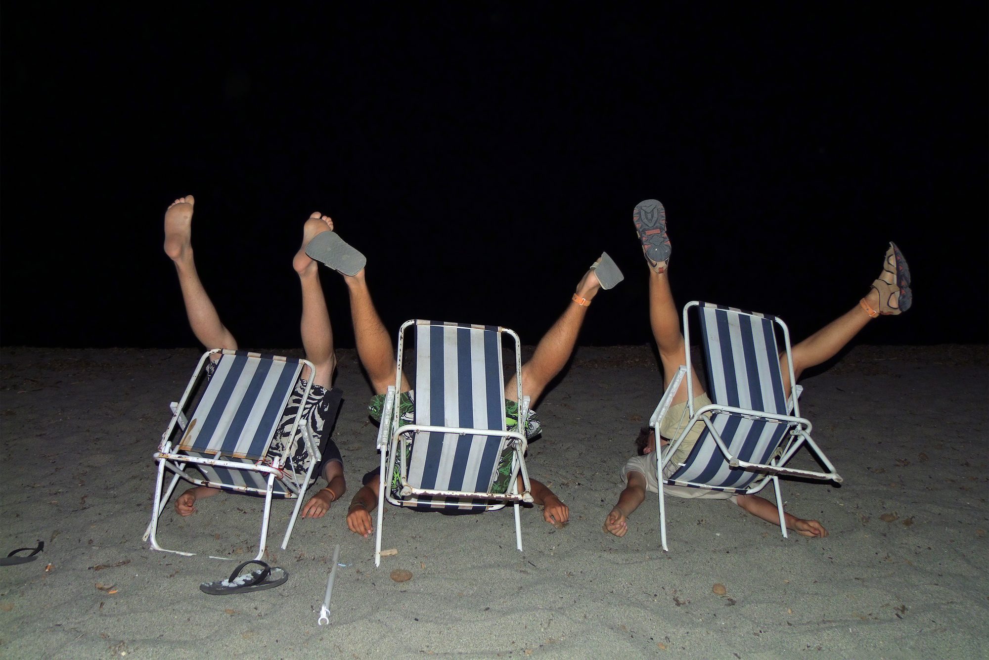 Crazy teenage beach boys fooling around