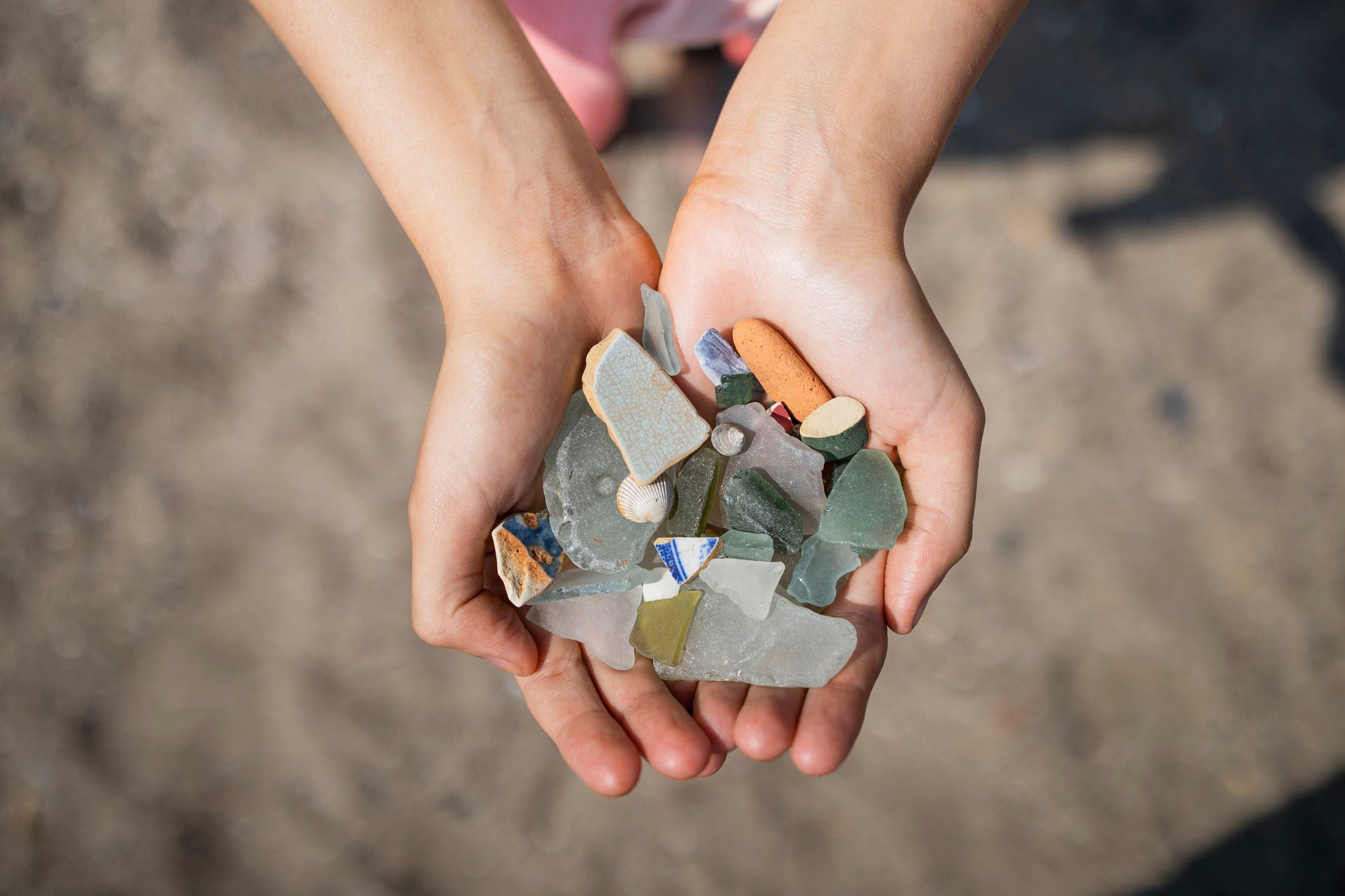 Sea glass and Shells in hands