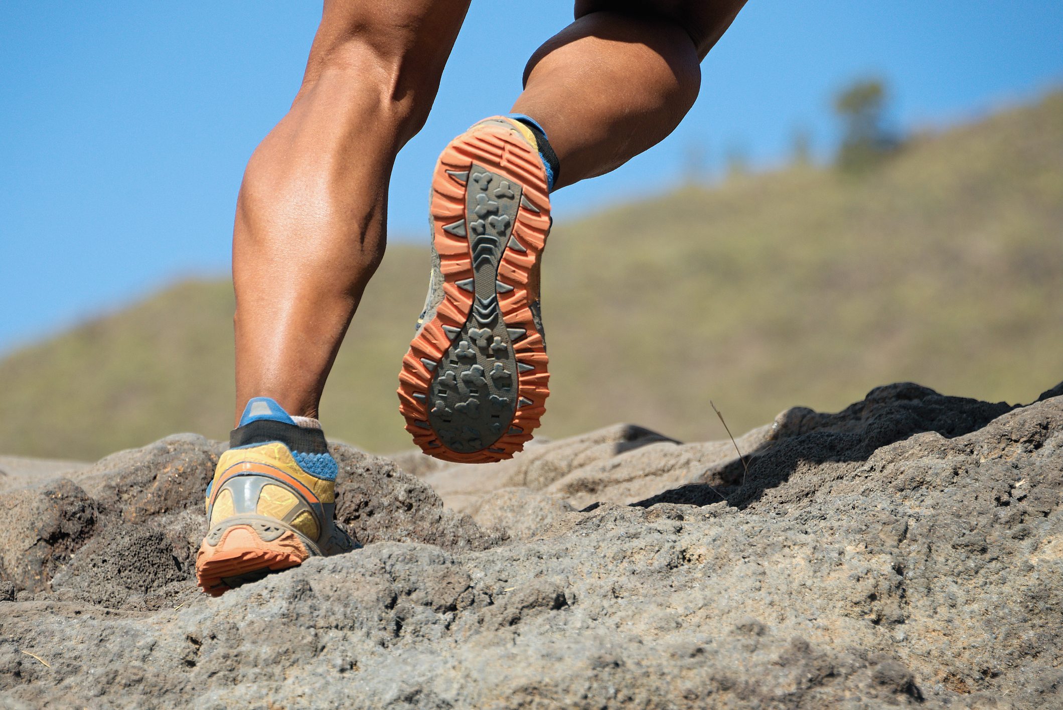 Athlete trail running in the mountains