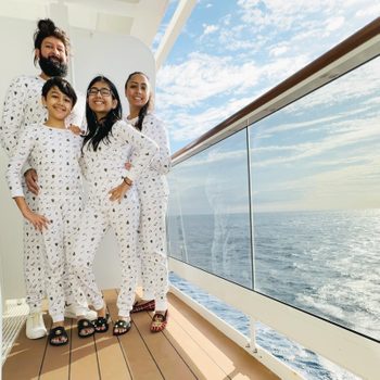 family of 5 in matching pajamas on a cruise