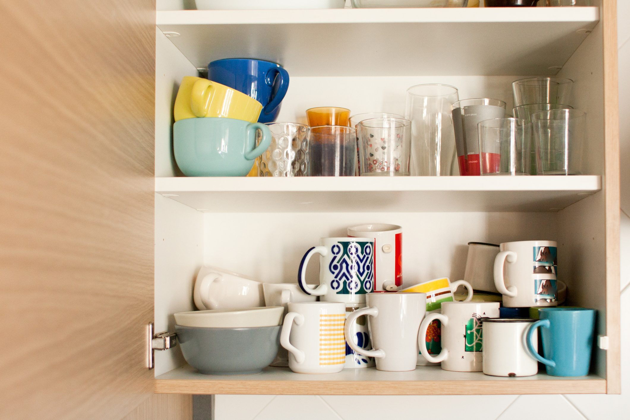 kitchen cabinet with mugs and glasses