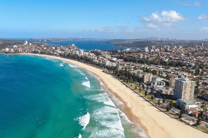 Panoramic high angle drone view of Manly Beach and the Sydney Harbour area. Manly is a popular suburb of Sydney, New South Wales, Australia. Famous tourist destination, easy to reach by ferry from CBD