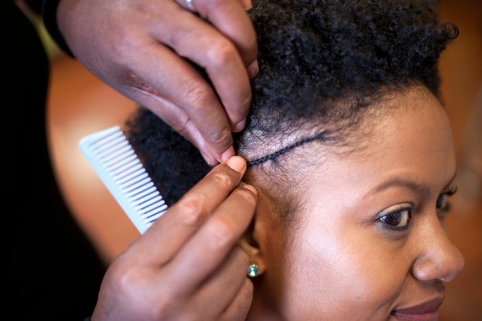 Woman Getting Hair Styled at Salon