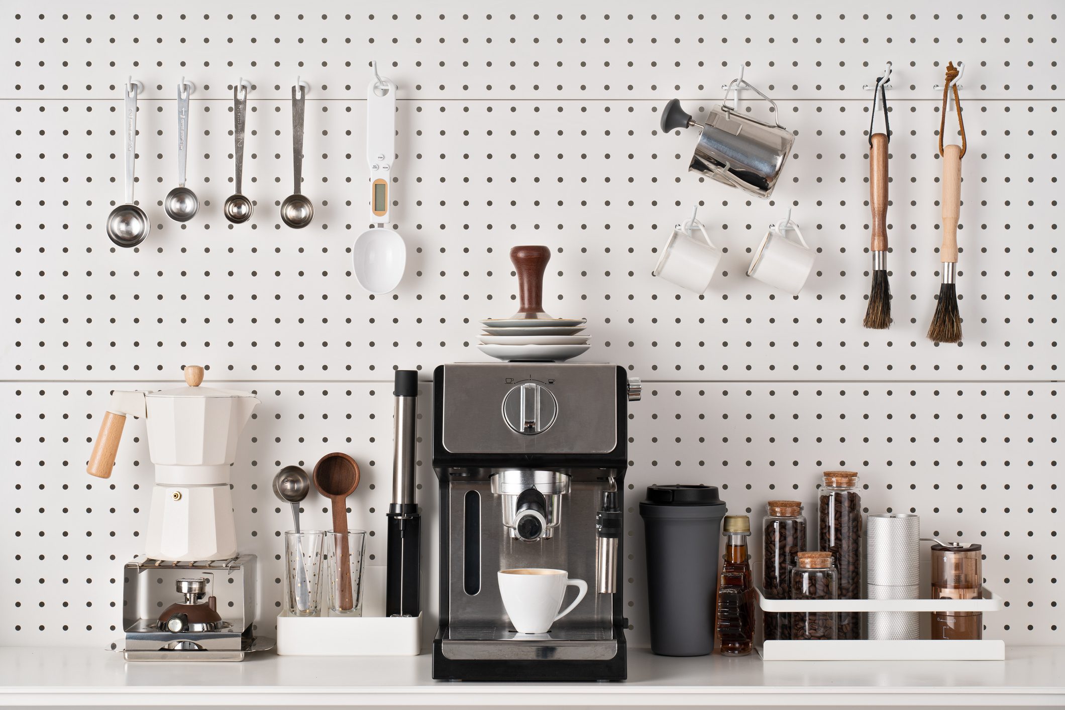 Espresso Coffee Maker and Accessories on Pegboard