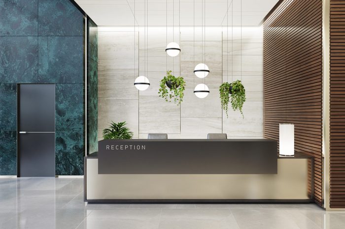 Modern Offices lobby interior area with elevators and stairs and with long reception desk