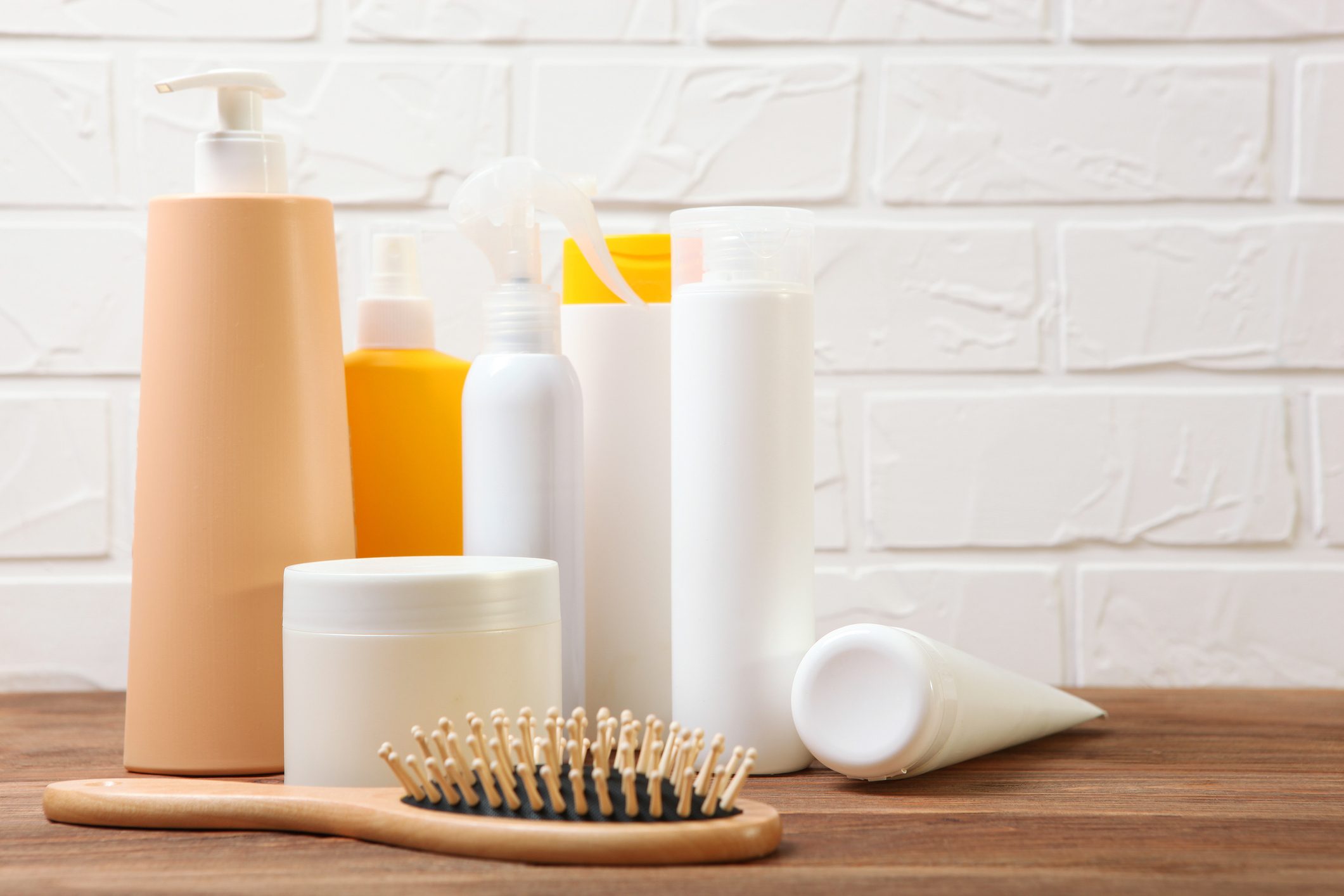hair care products and a comb on the table.