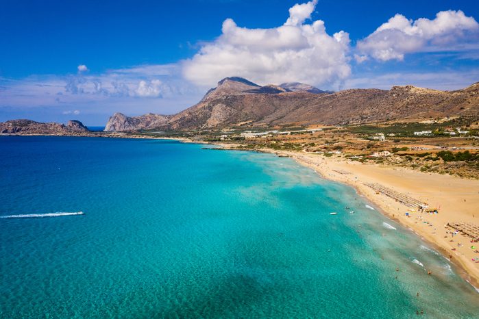 Aerial shot of beautiful turquoise beach Falasarna (Falassarna) in Crete, Greece. View of famous paradise sandy deep turquoise beach of Falasarna (Falassarna) in North West, Crete island, Greece.