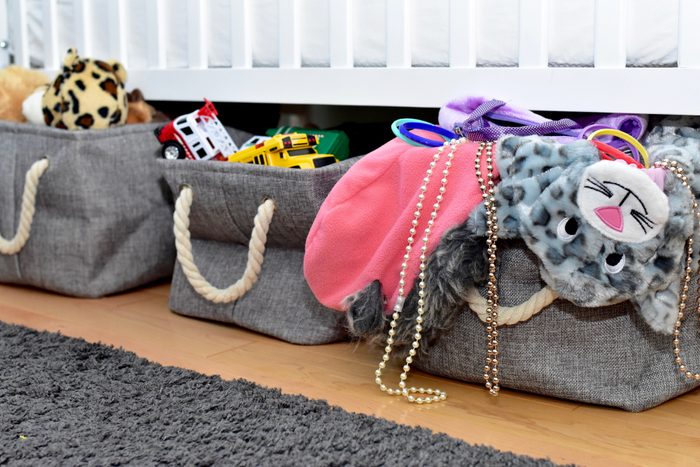 Easy storage solution drawers and basket bins under bench and crib