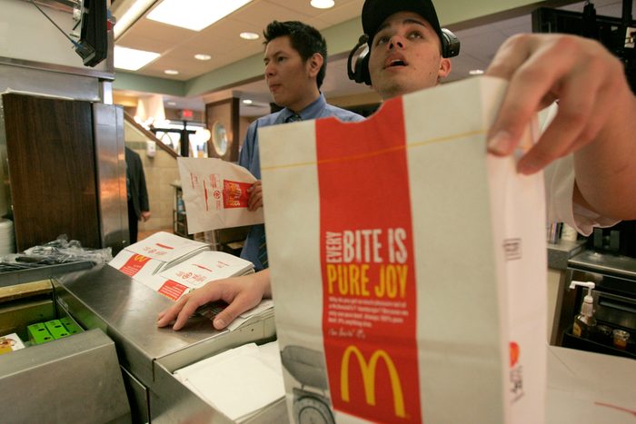 man calling an order number at McDonalds