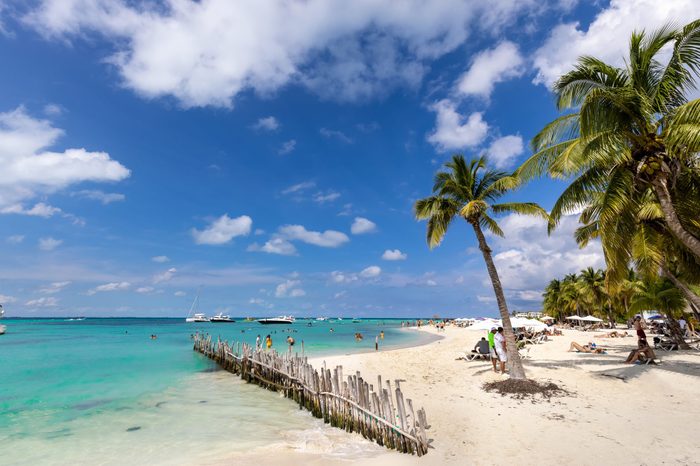 Serene turquoise Isla Mujeres beach Playa Norte famous for emerald waters, sandy sea shore and beach bars for fun and beach parties