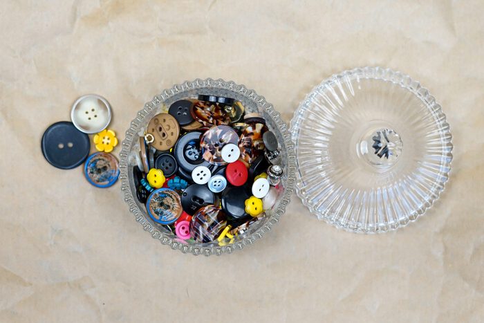 Glass Jar Storing Colourful Buttons