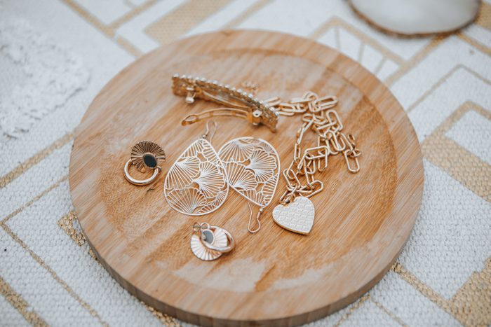 Earrings jewelry on wooden surface.Blogger.Fashion