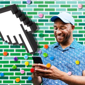 man using a smartphone agains a green tiled wall; over the photo are colored pompoms and a giant cursor hand