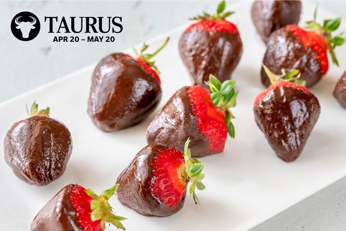 A plate of chocolate covered strawberries