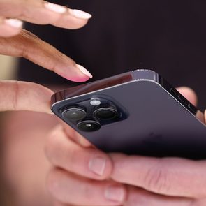 Attendees examine a brand new iPhone 14 Pro during an Apple special event on September 2022 in Cupertino, California