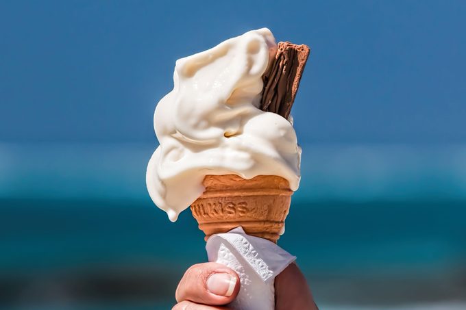 woman holding ice cream who begin melting
