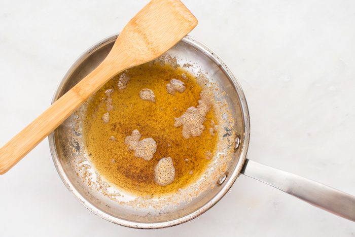 Browned Butter in a Skillet with a Wood Spatula