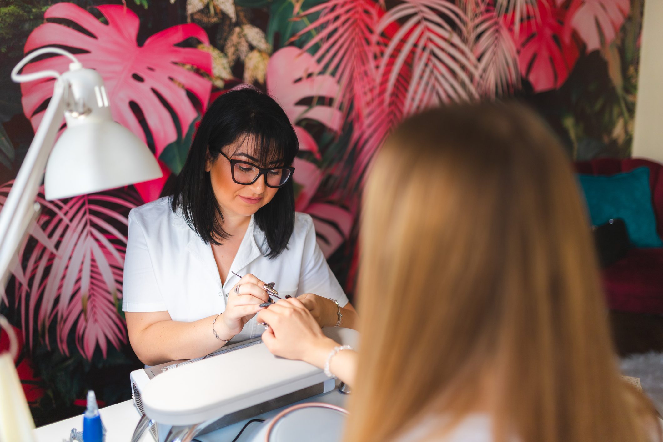 Young beautician working with a client in a professional salon