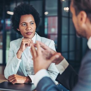 Middle aged businesswoman in a conversation with a colleague