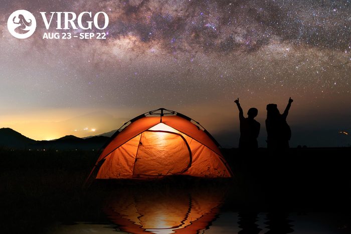 camping under the stars in an an orange tent