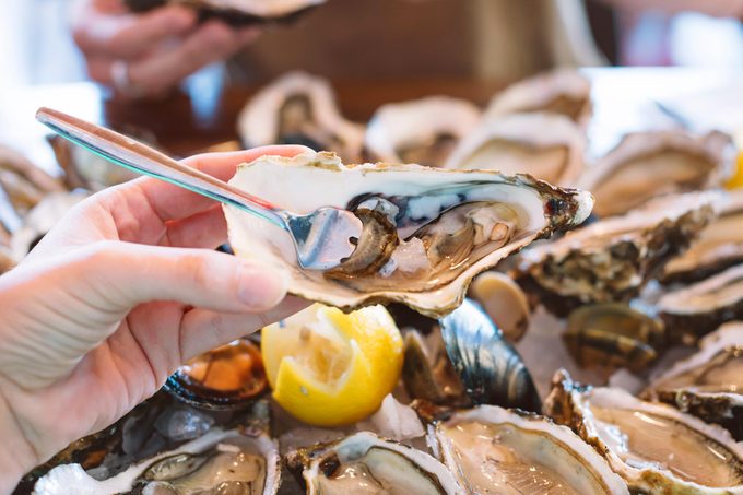 loosen oyster with a fork
